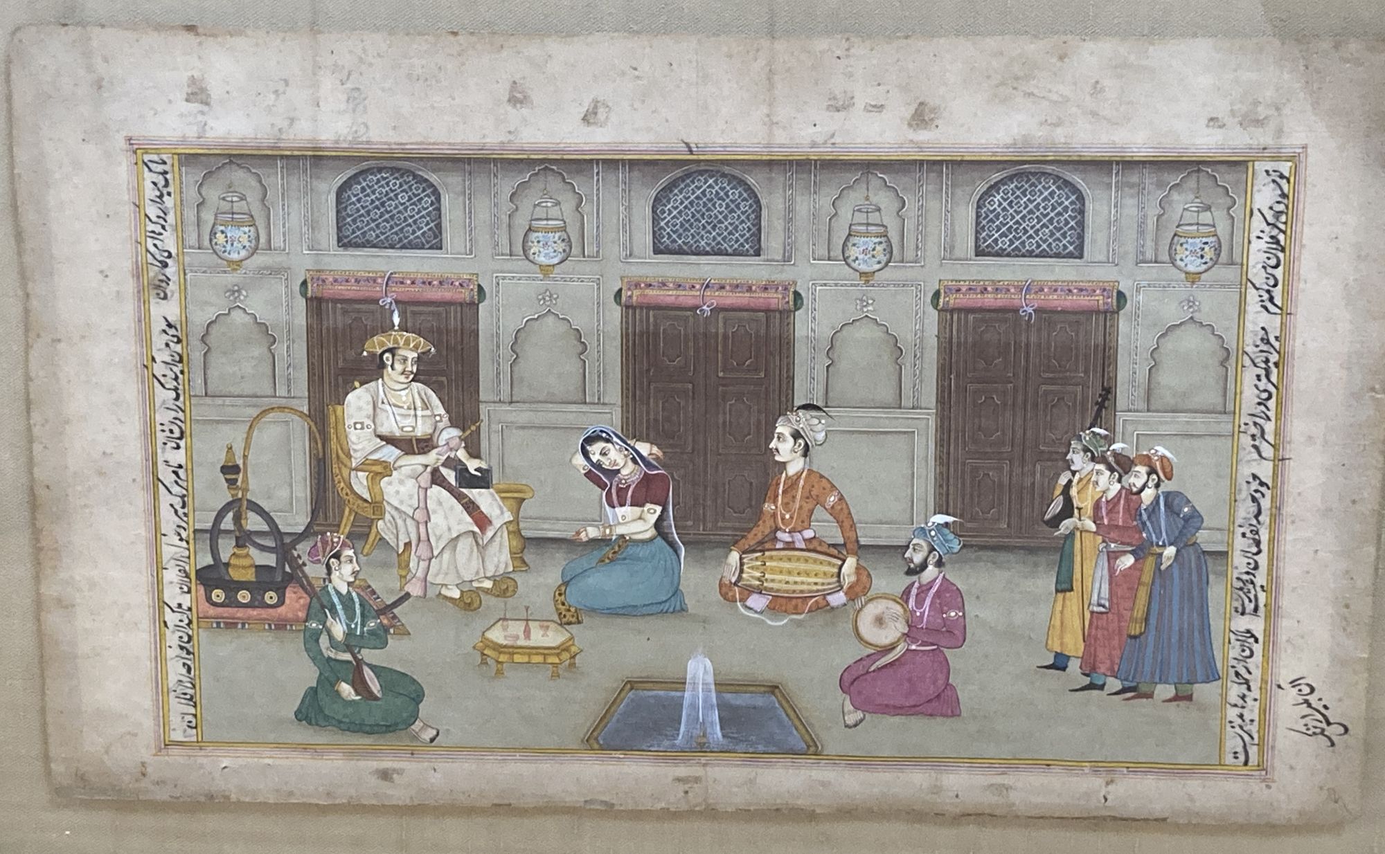 A set of three Indian miniature paintings, Mughal style, on inscribed pages, Interiors with noblemen, overall 34.5 x 20cm and 20 x 34.5